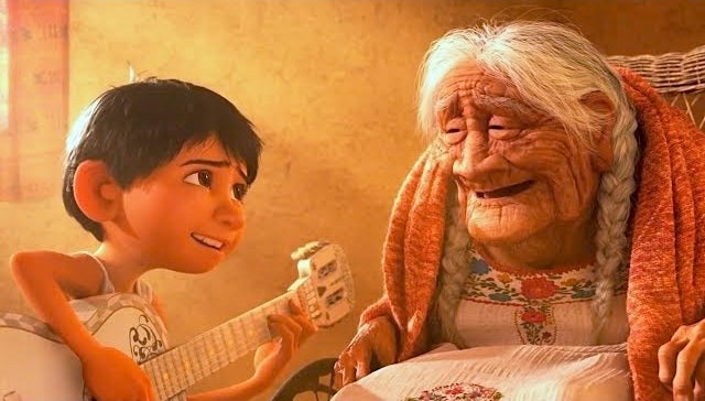 Miguel playing guitar to his grandma arsenic  they some  sing unneurotic  successful  the animated movie  Coco