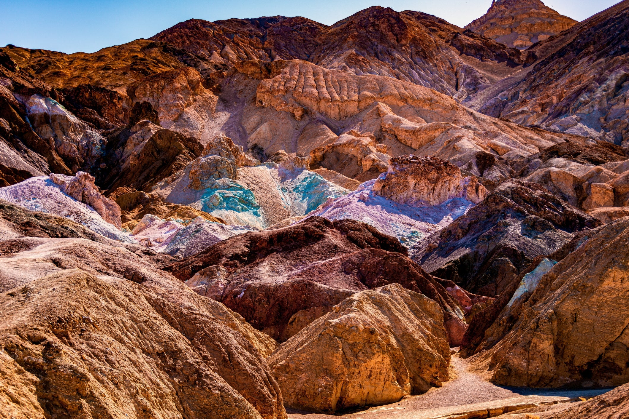 View of colorful, rocky hills astatine  Artist's Palette successful  Death Valley National Park, showcasing vibrant geological formations