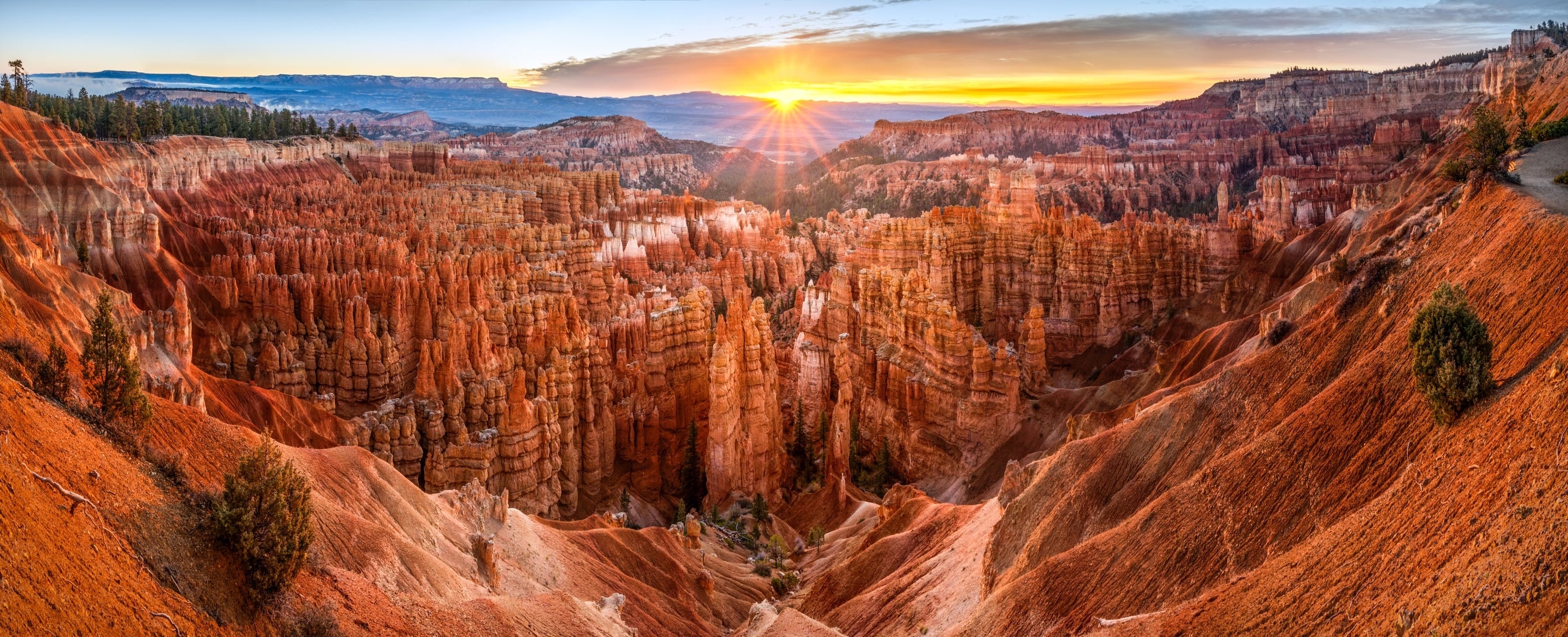 Panoramic presumption    of Bryce Canyon astatine  sunrise, showcasing unsocial   stone  formations and immense   landscapes