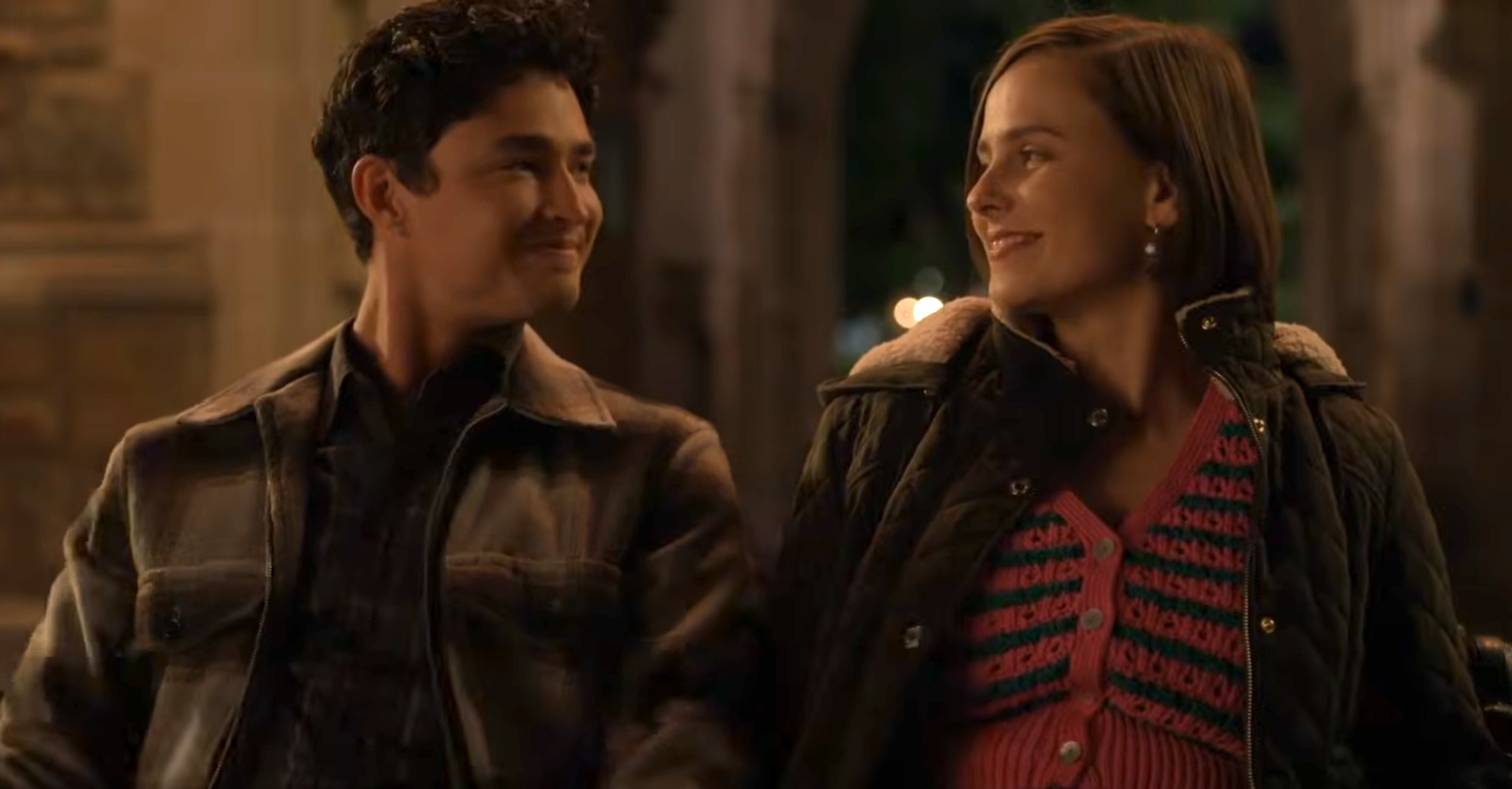 Two radical   walking and smiling astatine  each   different   successful  an outdoor setting, wearing casual jackets