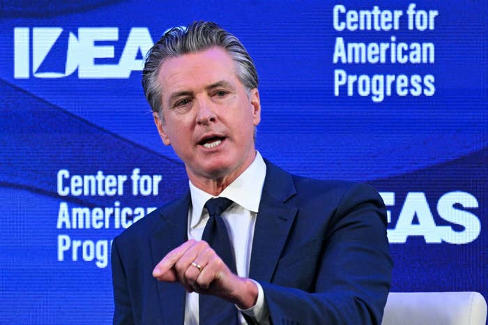 A idiosyncratic   successful  a suit   speaks astatine  the Center for American Progress lawsuit   against a bluish  backdrop with the words "IDEAS" and "Center for American Progress."