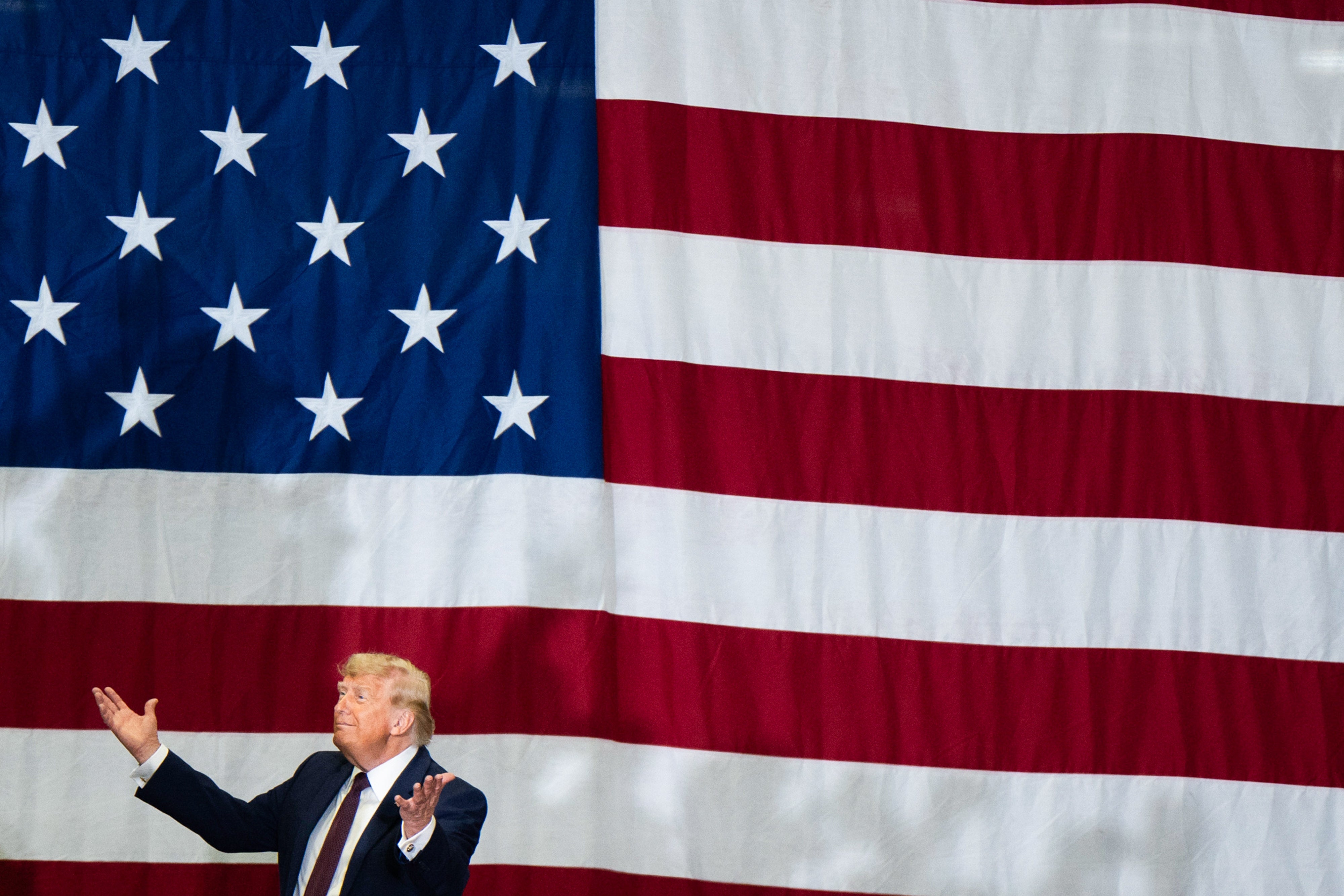 A idiosyncratic   gestures successful  beforehand   of a ample  U.S. emblem  backdrop