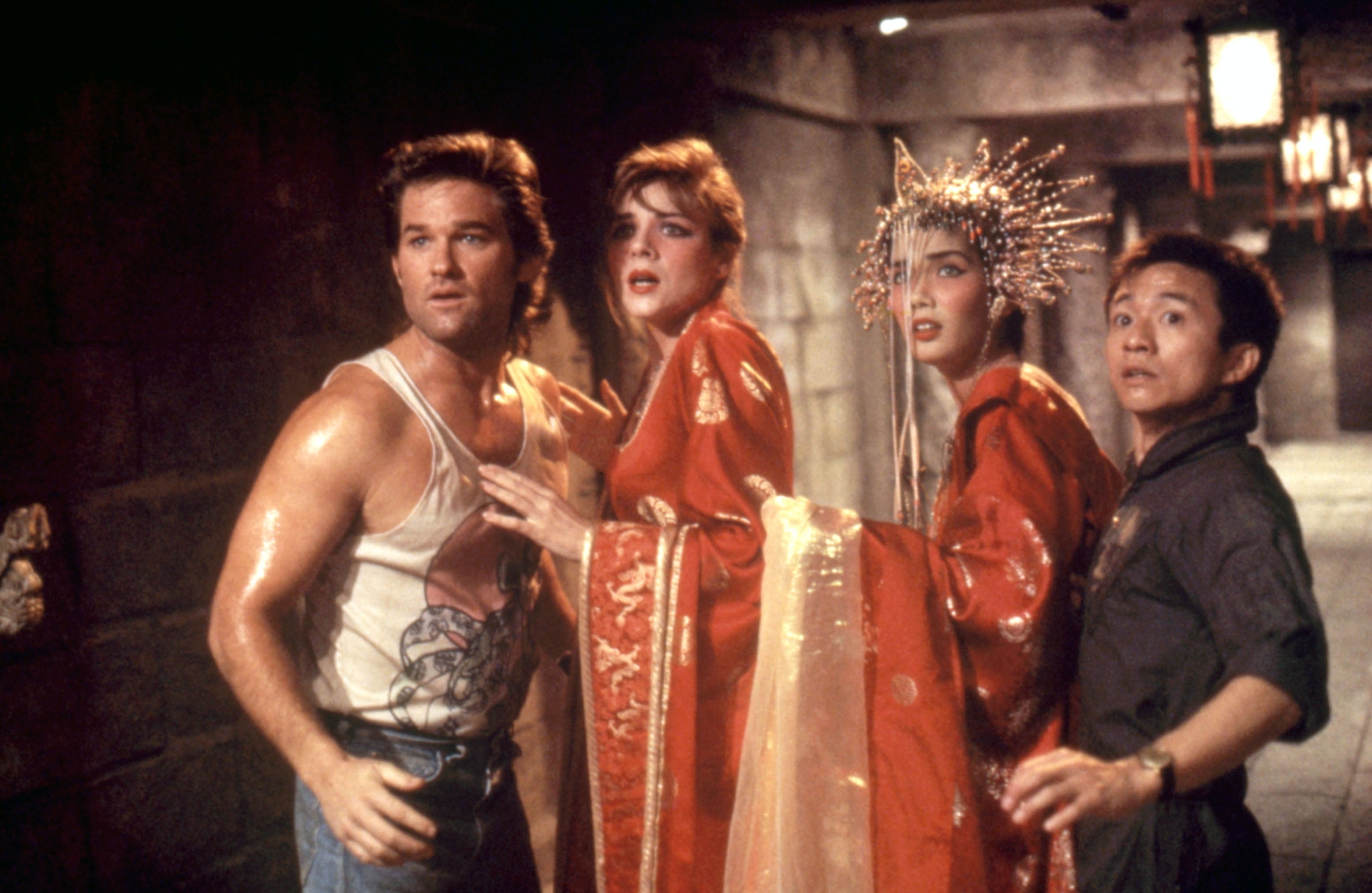 Four radical   successful  a melodramatic  scene, 1  wearing a vest, 2  successful  ornate robes with headdresses, and different  successful  casual attire, look  surprised