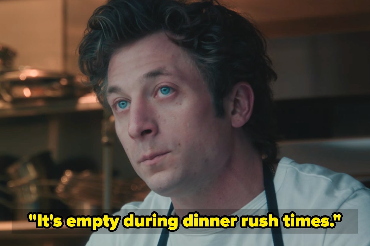 Person in a kitchen with shelves of pots, wearing a white shirt and apron, looking up. Text: "It's empty during dinner rush times."