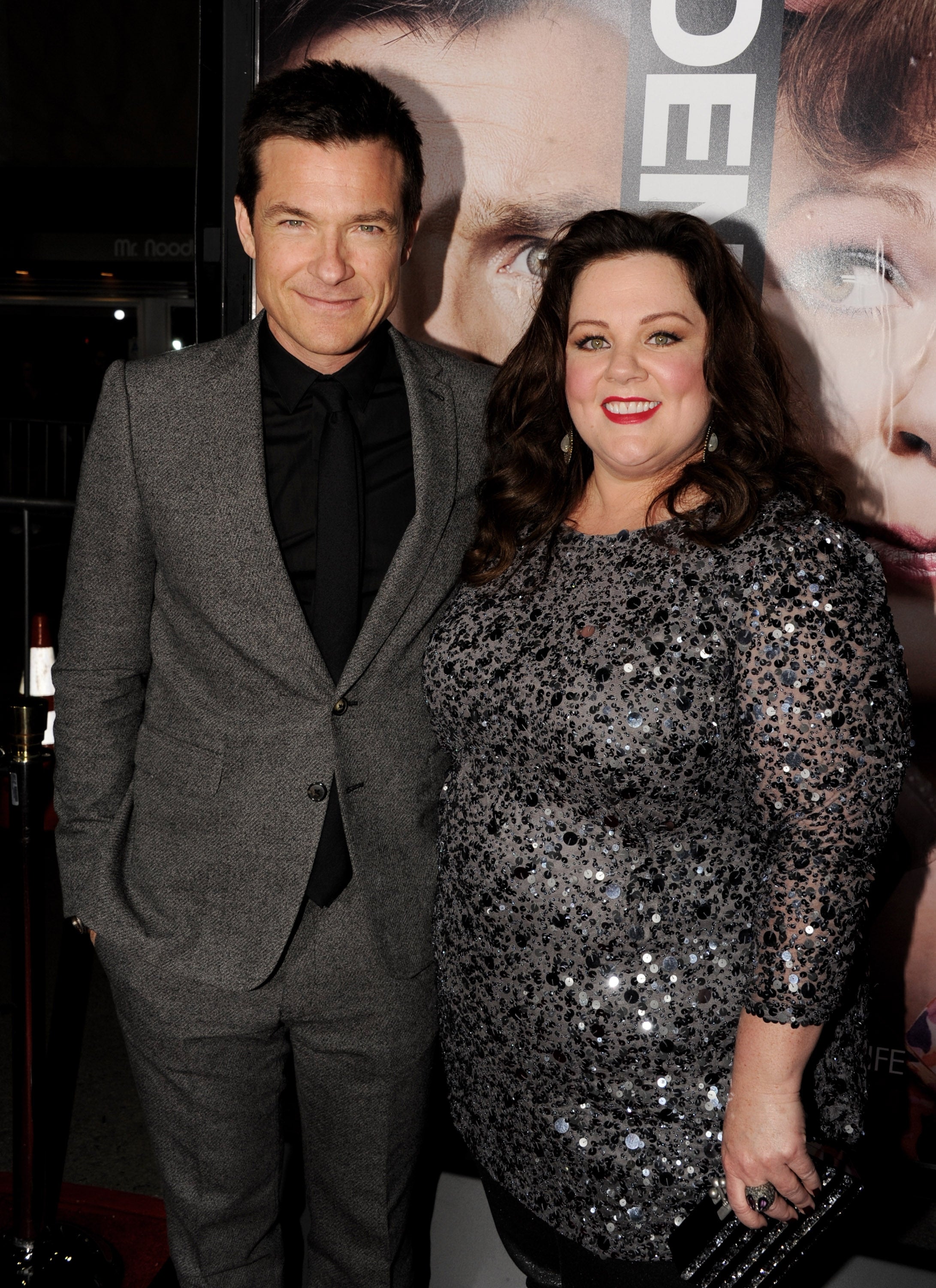 Jason Bateman and Melissa McCarthy smiling at a red carpet event