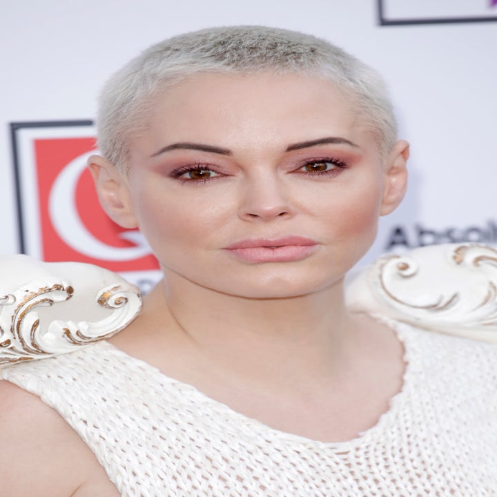 Rose McGowan with short hair wearing a textured top and unique shoulder details at a celebrity event