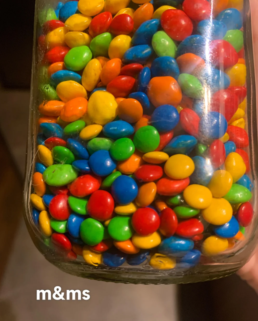 Jar filled with colorful M&amp;amp;Ms, with the label "m&amp;amp;ms" at the bottom left