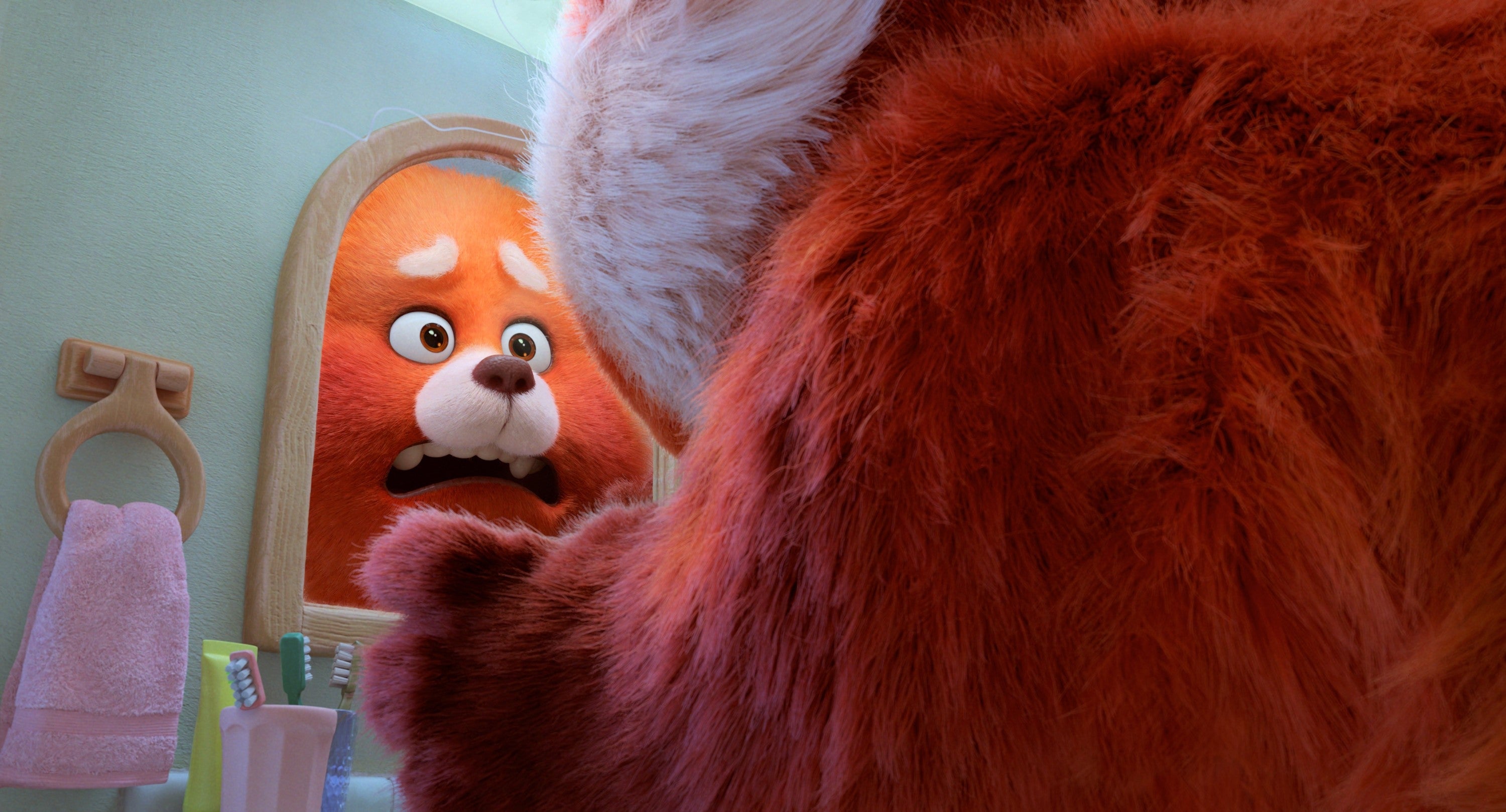 Animated panda looks shocked at its reflection in a bathroom mirror
