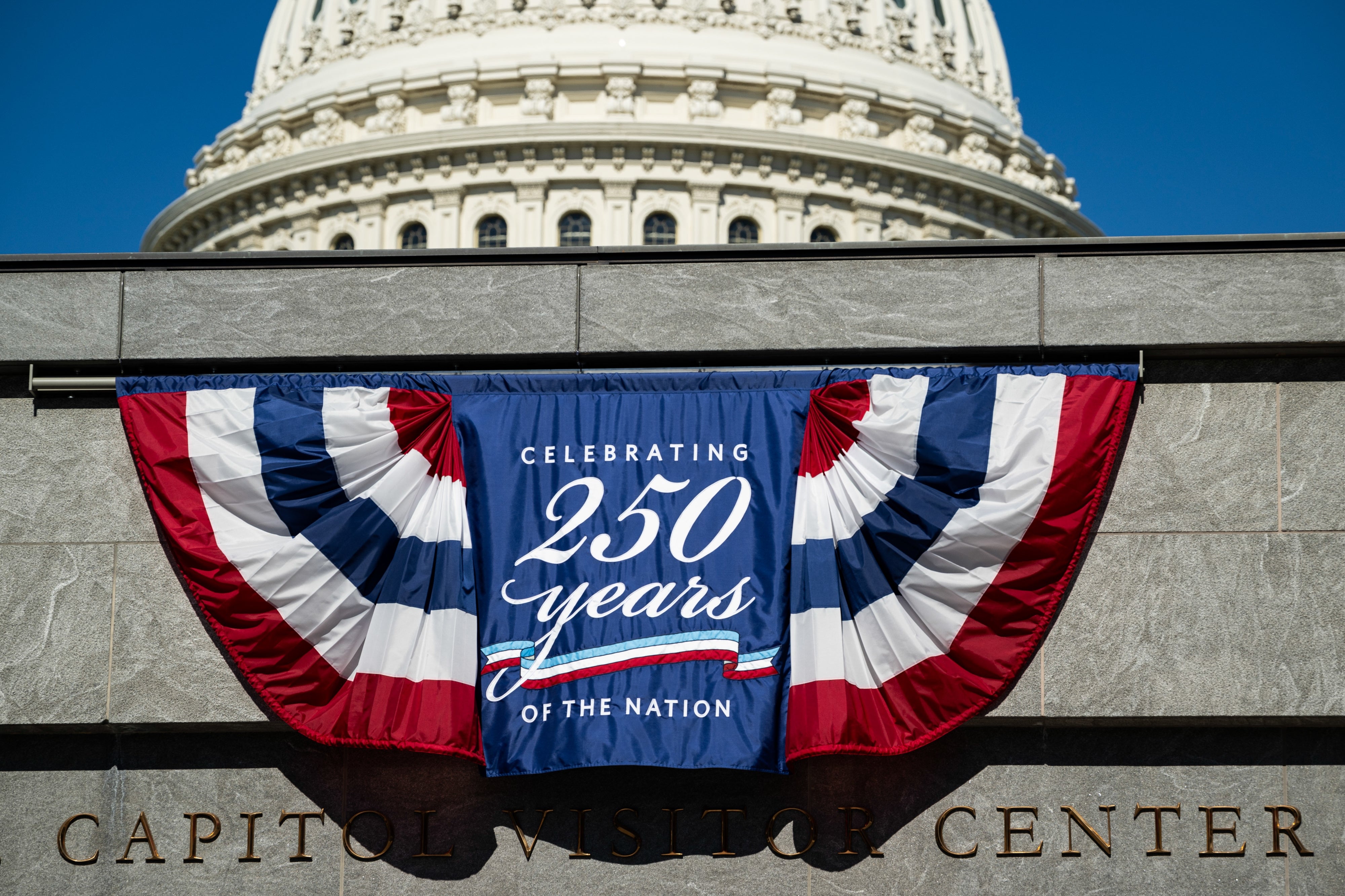 "Celebrating 250 Years of the Nation." The U.S. Capitol dome is disposable successful the background
