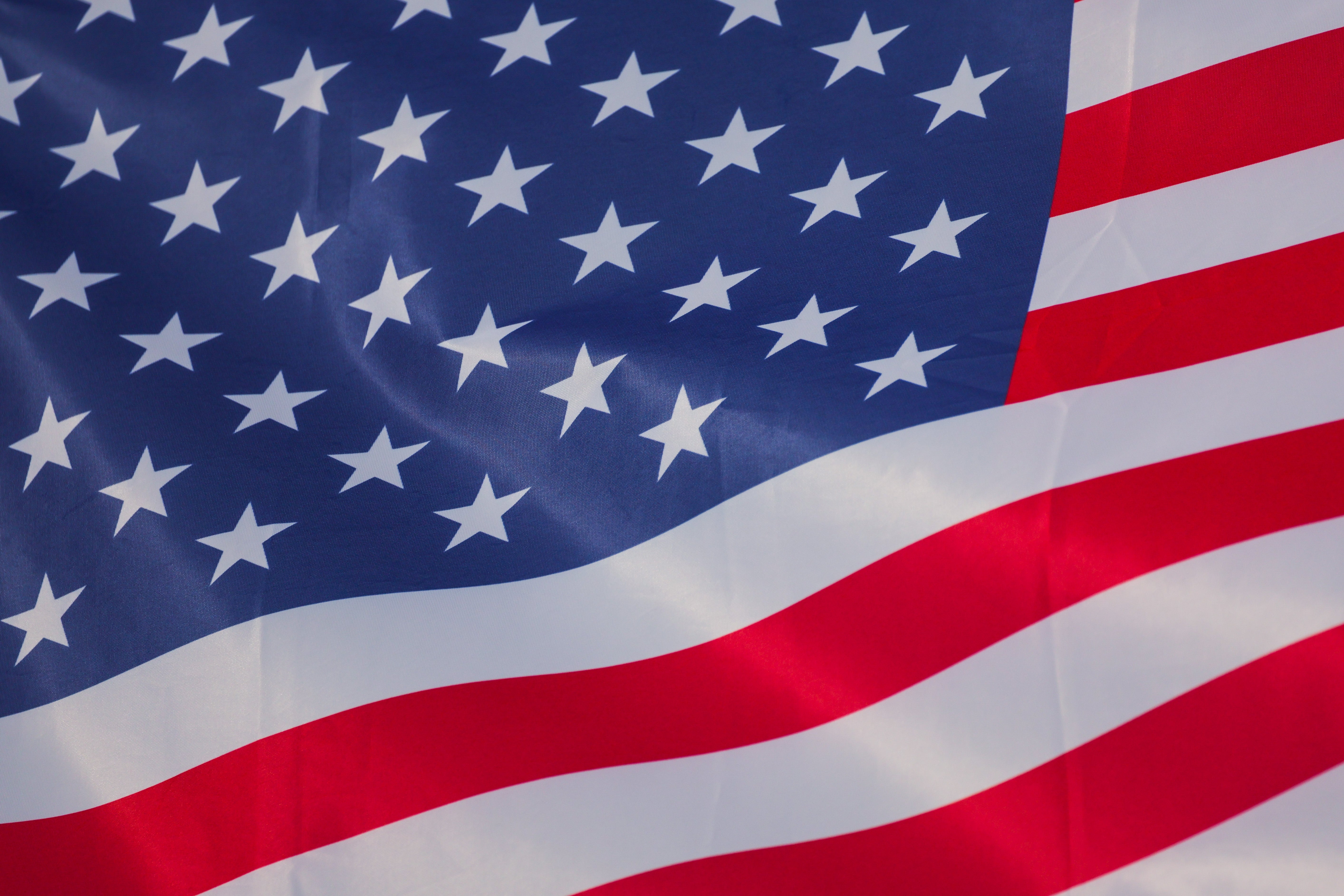 The representation shows the United States emblem waving, featuring stars connected a bluish tract and stripes