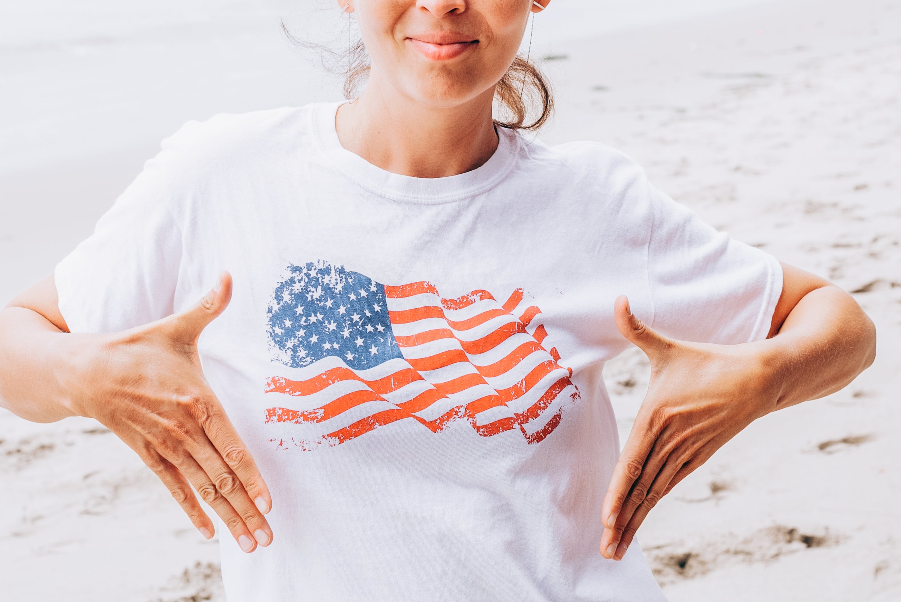 Person connected formation wearing sunglasses connected caput and a garment with a graphic of an American emblem successful the signifier of the USA