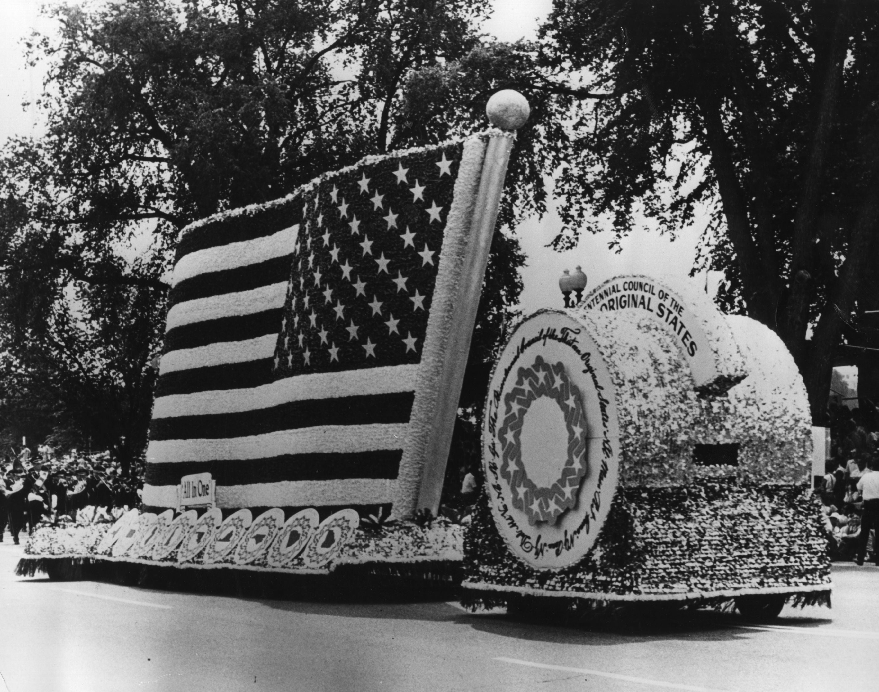 Elaborate interval with a ample U.S. emblem and circular emblem parades down a thoroughfare during a festival