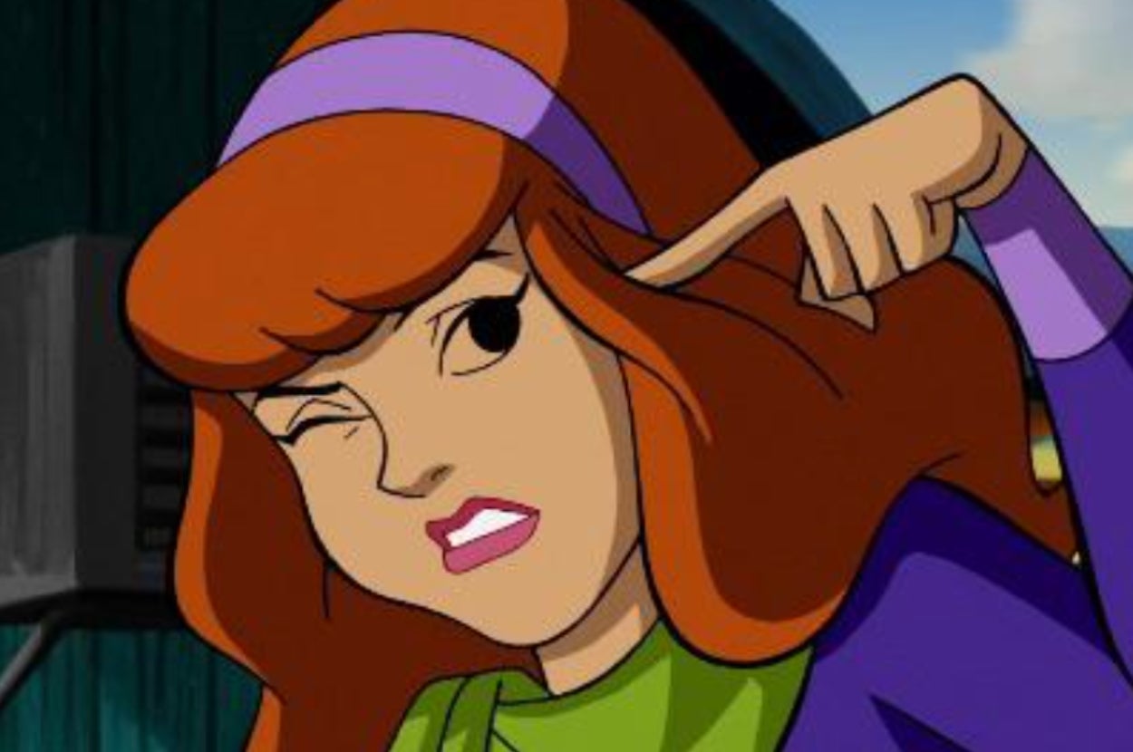 Animated Daphne from "Scooby-Doo" plugs her ear and looks annoyed