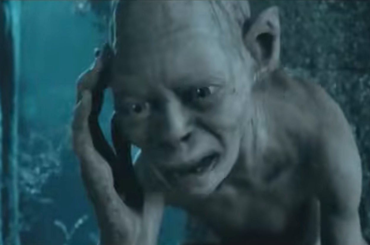 Gollum from "Lord of the Rings" touching side of head, appearing distressed in a forest setting