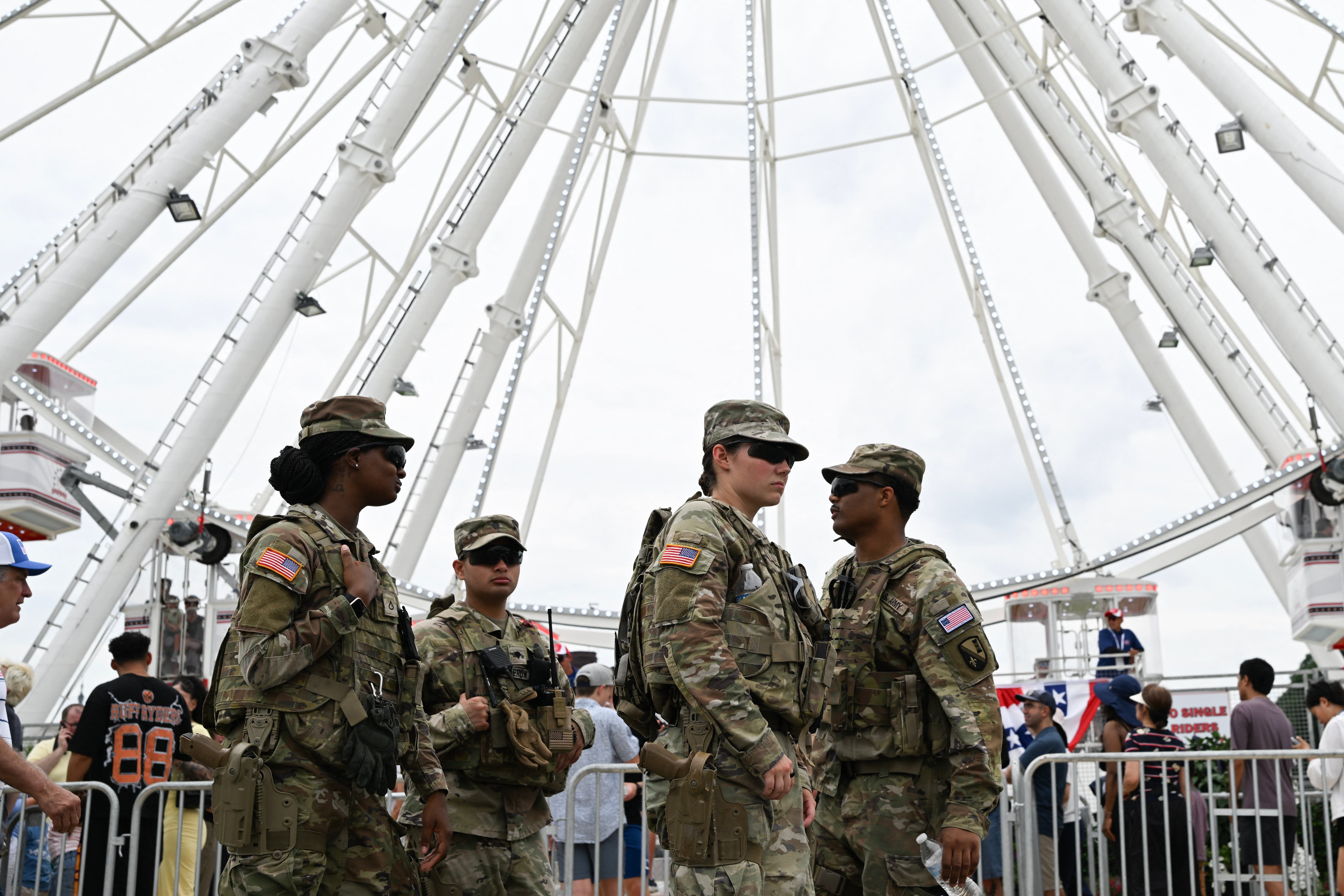 Military unit successful azygous basal successful beforehand of a Ferris wheel, interacting with each different arsenic radical walk by