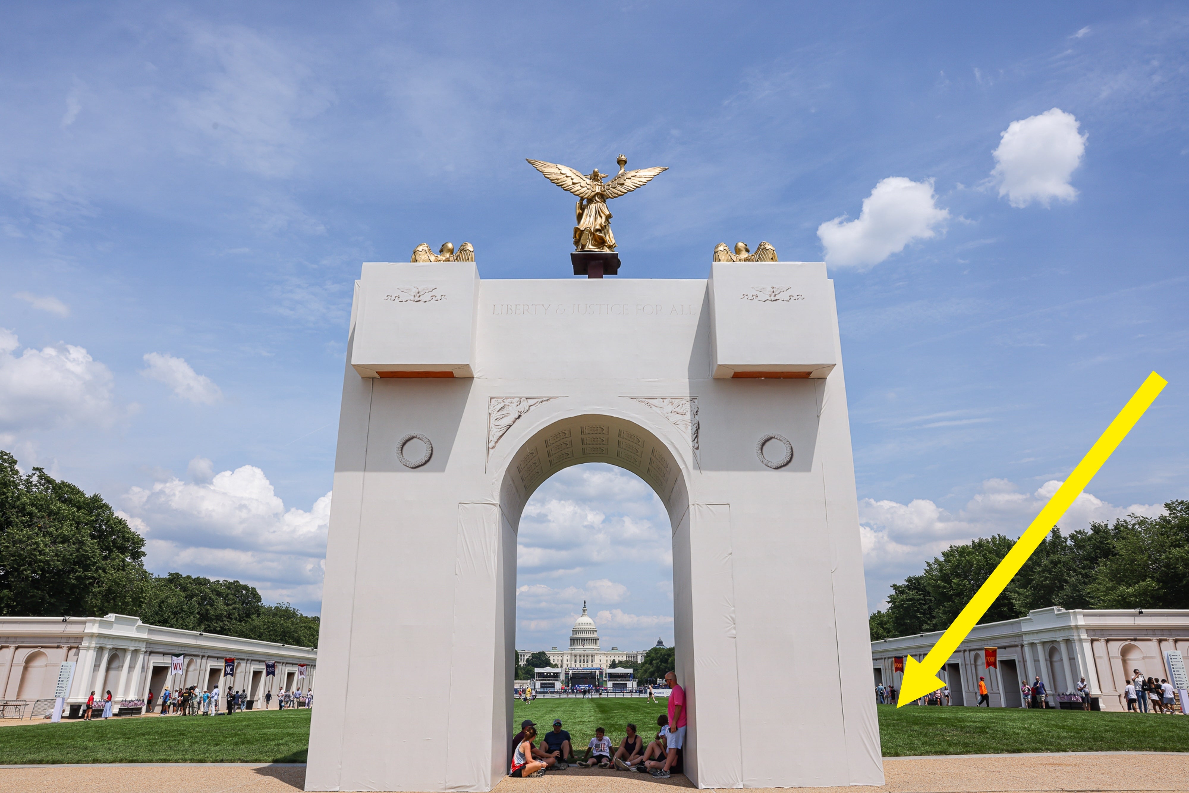 A radical of radical beryllium nether a ample achromatic arch with a aureate eagle connected top, the U.S. Capitol dome disposable successful the background