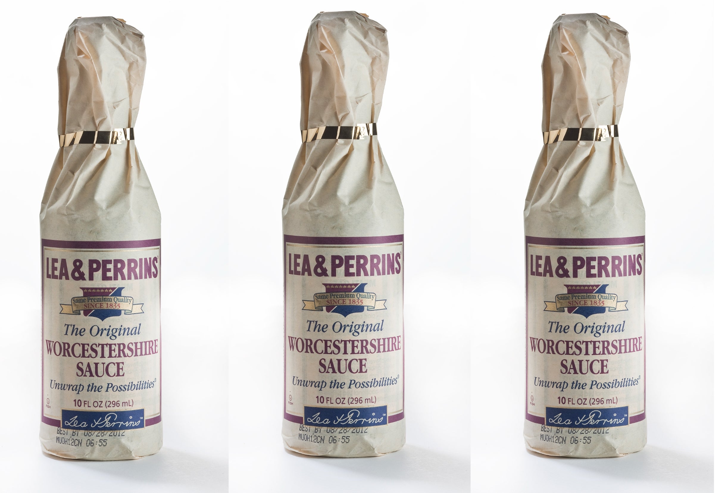 Three bottles of Lea &amp;amp; Perrins Worcestershire Sauce wrapped successful  insubstantial  with labels showing marque  logo and tagline "Unwrap the Possibilities."