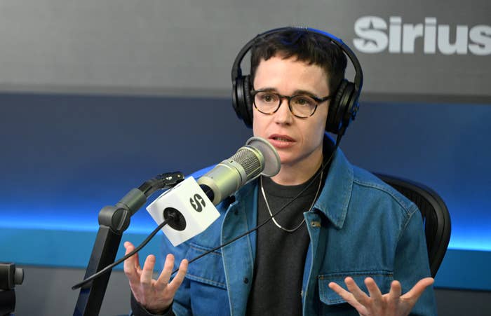 Elliot speaking into a microphone successful  a vigor   studio