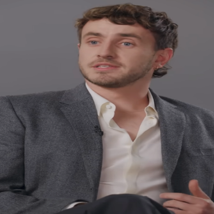 A person in a blazer and open-collared shirt speaks in an interview setting with a "Variety" logo in the corner