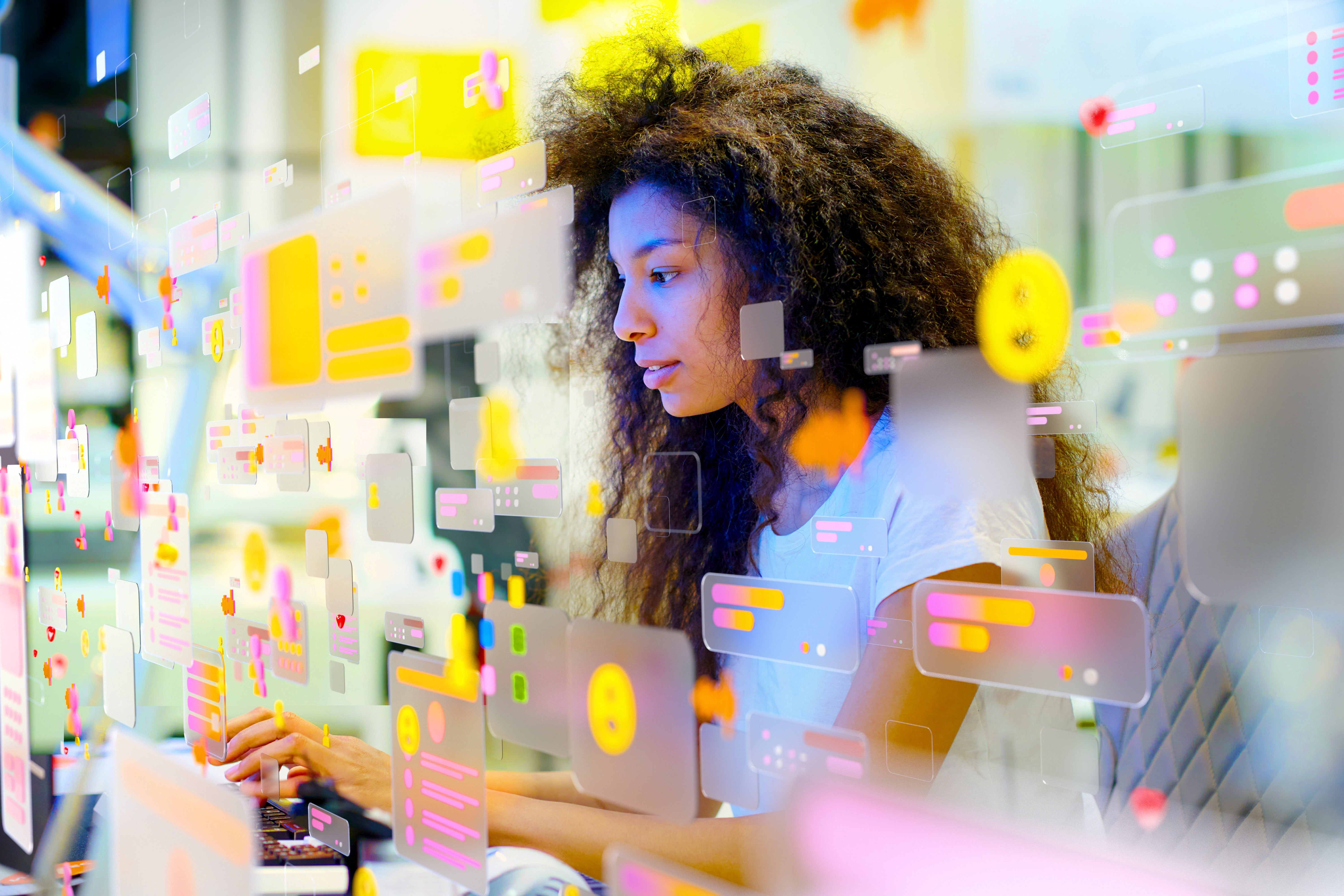 Woman typing connected a machine surrounded by floating integer icons and screens