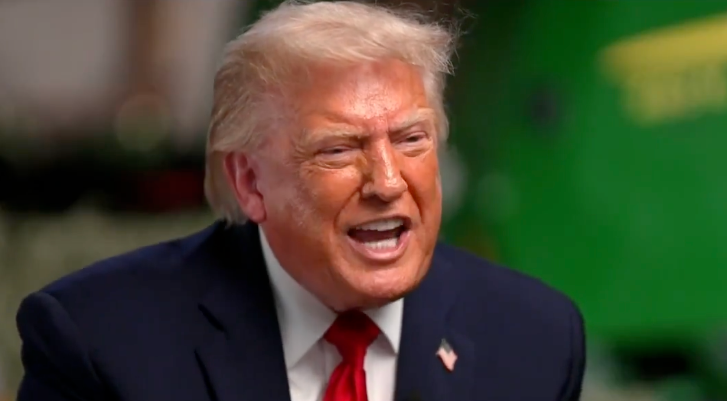 A idiosyncratic successful a suit is speaking animatedly during an interview