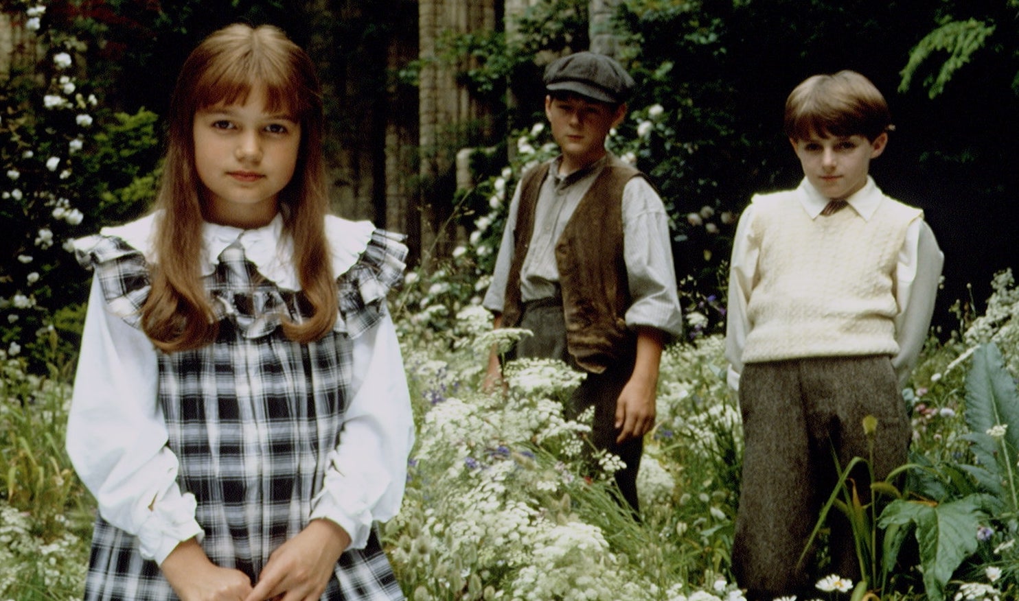 The kid  actors successful  The Secret Garden basal   successful  vintage covering  successful  a lush garden.