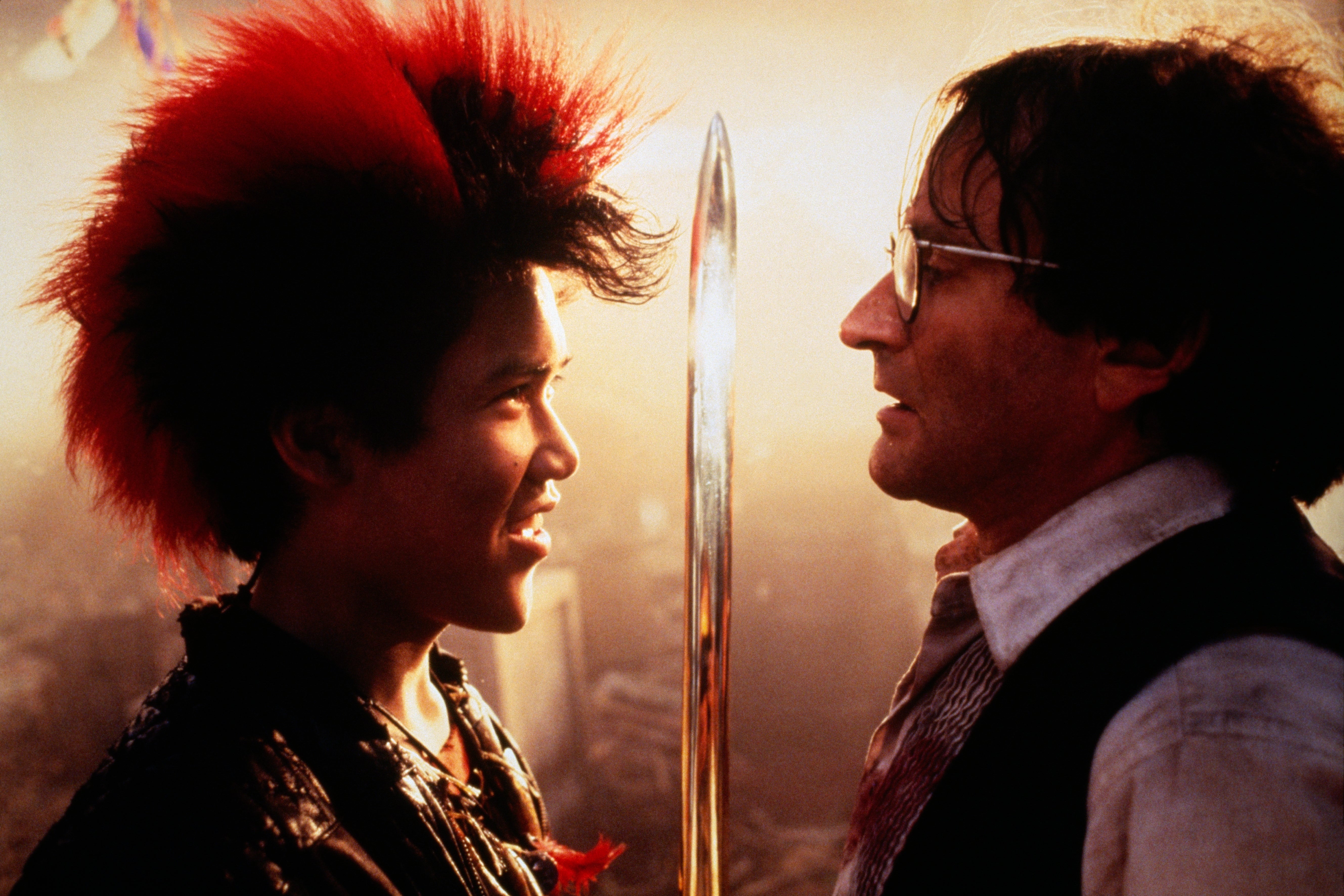 Dante Basco and Robin Williams connected  the acceptable   of the movie  Hook with a sword successful  betwixt  them