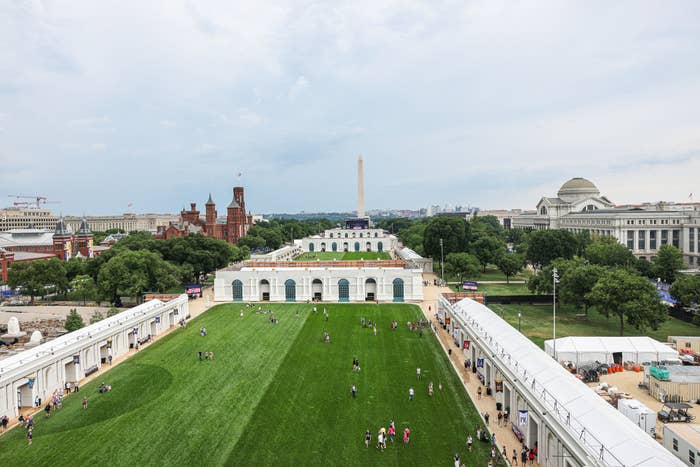 People locomotion  connected  a ample  tract   with humanities  buildings successful  the background