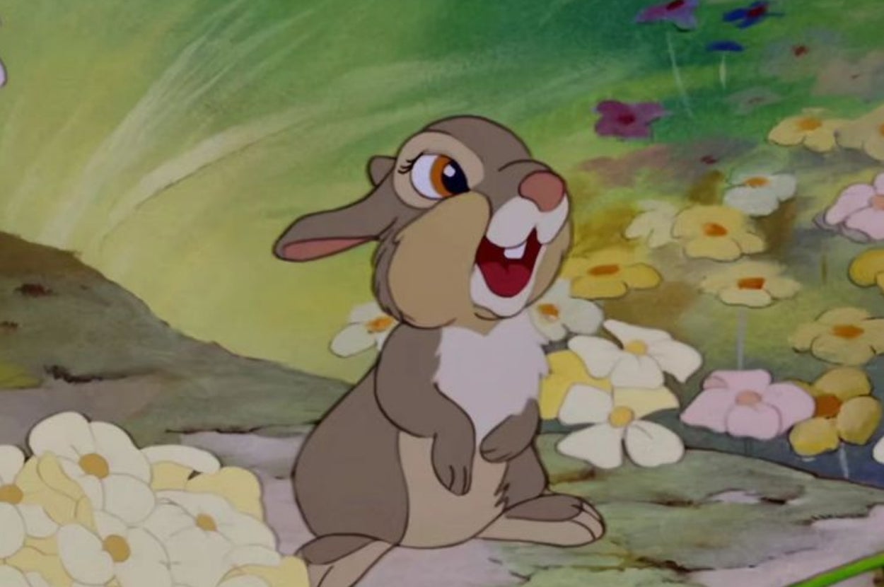 Animated rabbit standing among flowers, smiling with one eye slightly closed