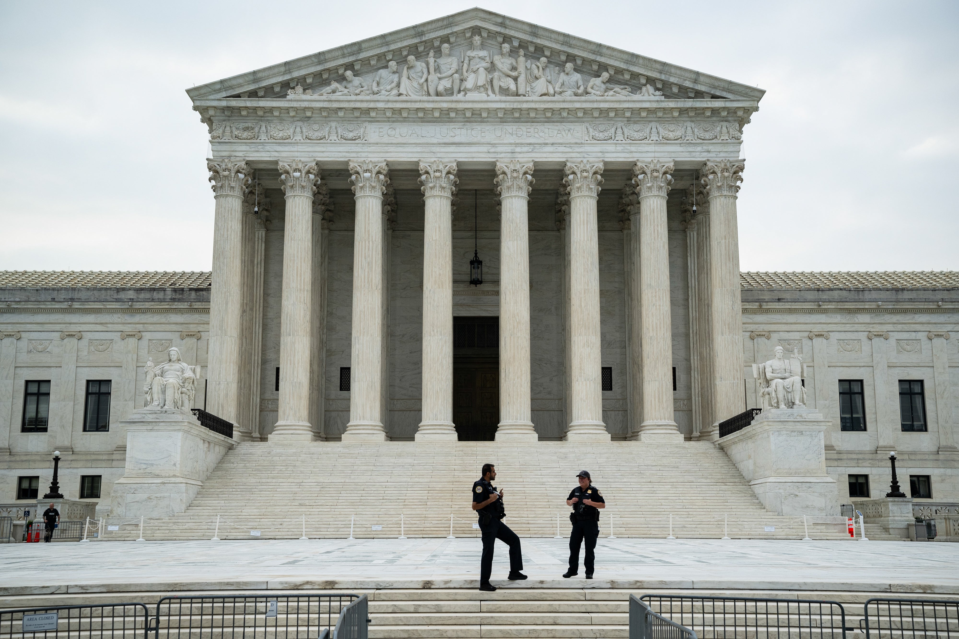 U.S. Supreme Court gathering with 2 information unit lasting successful front, discussing connected a quiescent day