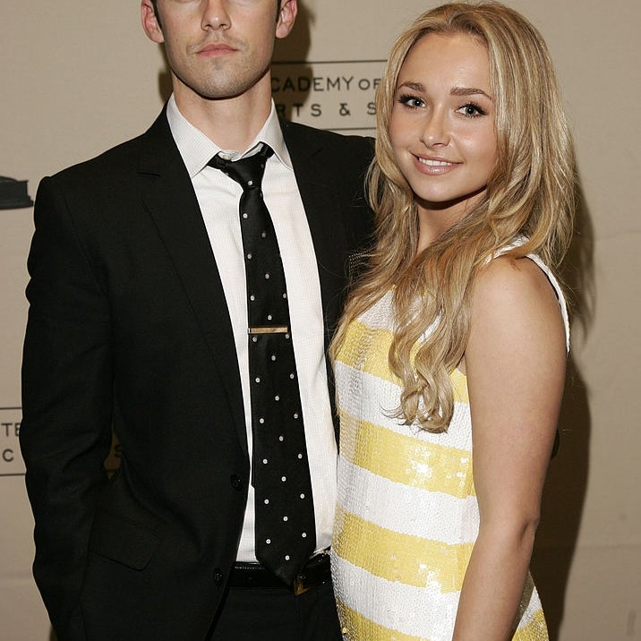 Milo Ventimiglia and Hayden Panettier pose on a red carpet