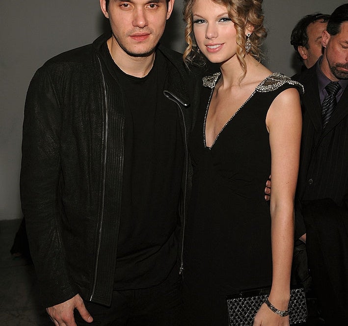 John Mayer and Taylor Swift posing together at an event