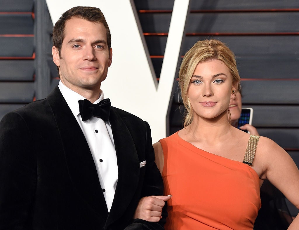Henry Cavill and Tara King attend the 2016 Vanity Fair Oscar Party and pose on the carpet