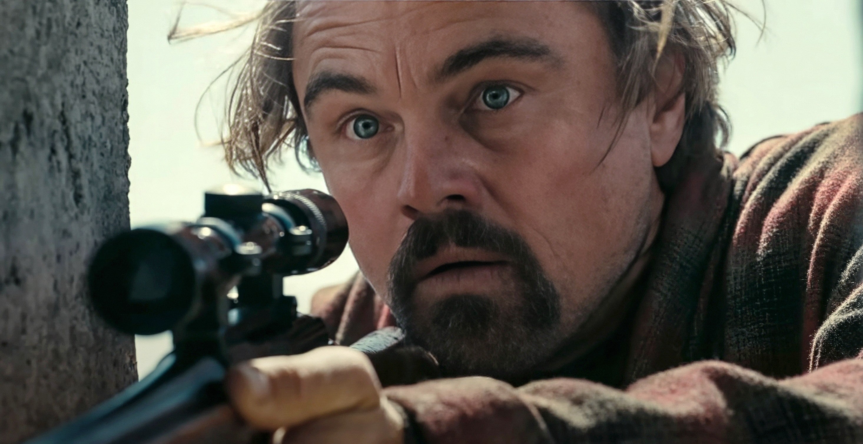 Leonardo DiCaprio with intense expression aiming a rifle, wearing a rugged flannel shirt