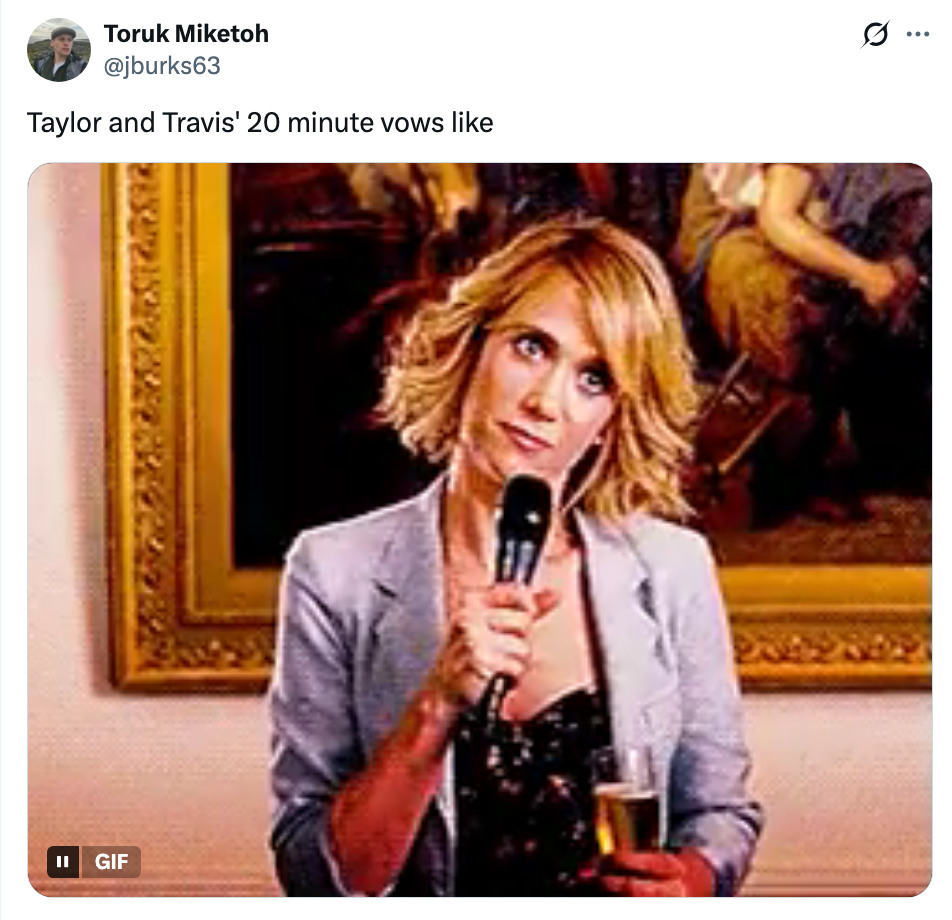 Woman holding a microphone, looking unimpressed in a formal setting. Caption compares scene to Taylor and Travis's vows.