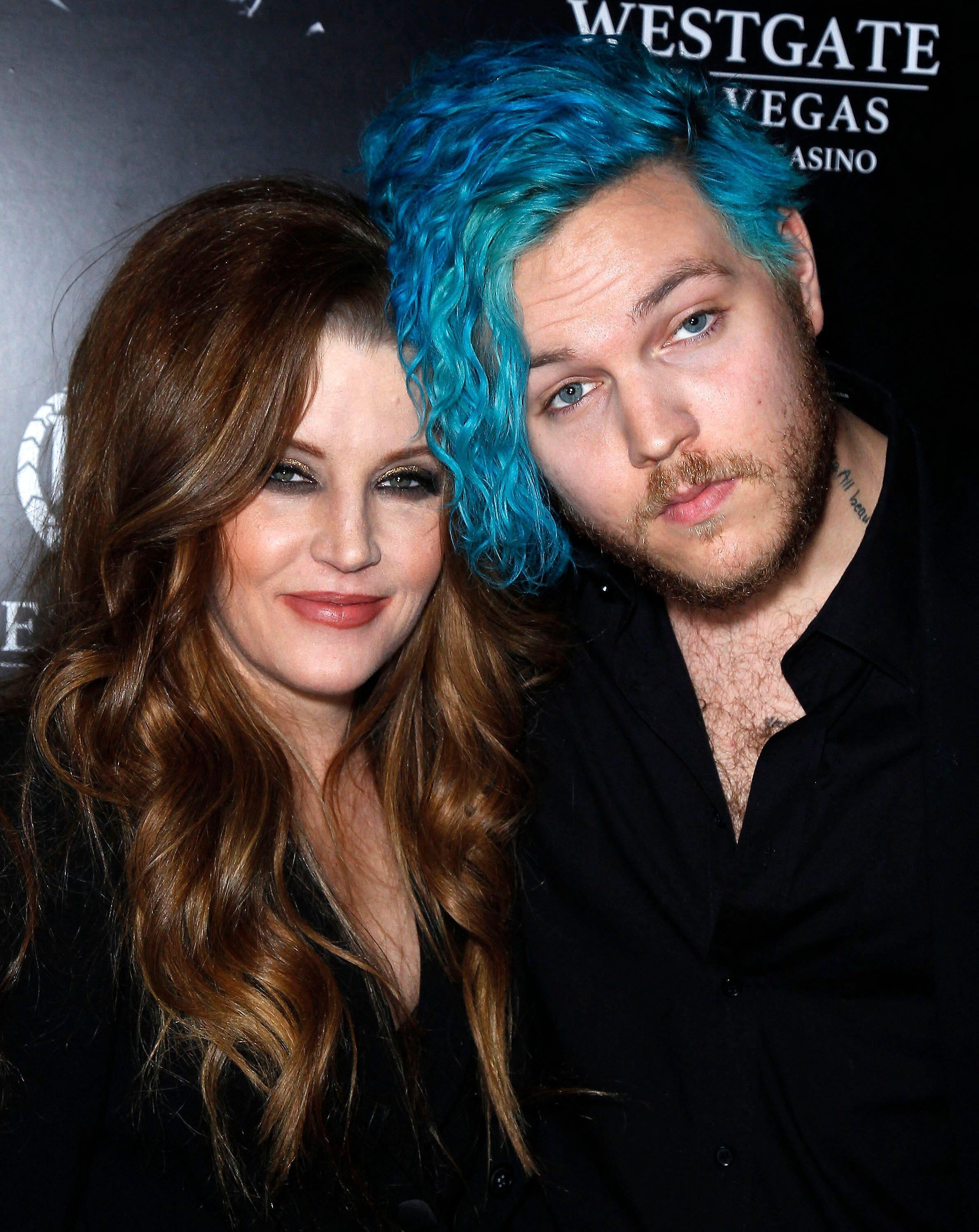 Two radical posing astatine an event. The idiosyncratic connected the near has long, wavy hair, and the idiosyncratic connected the close has curly, vibrant hairsbreadth styled uniquely