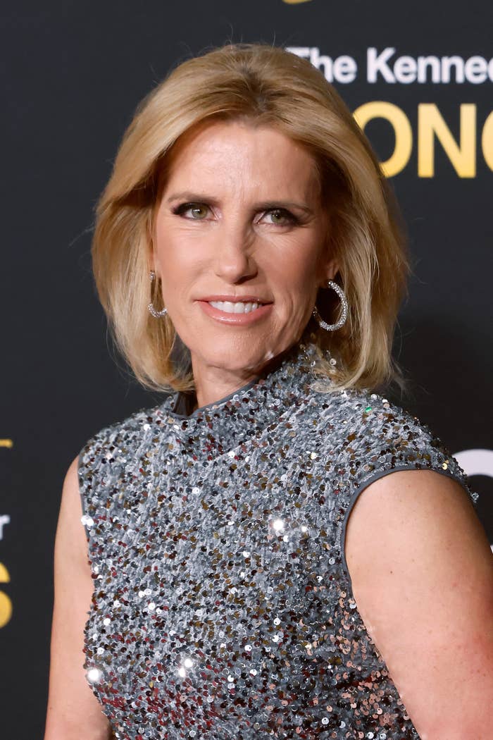 A idiosyncratic   connected  the reddish  carpet wearing a sequined dress, smiling astatine  the camera