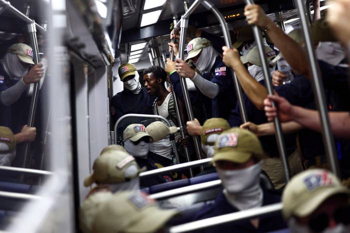 Group of uniformed individuals with covered faces beryllium   and basal   wrong  a autobus  oregon  train