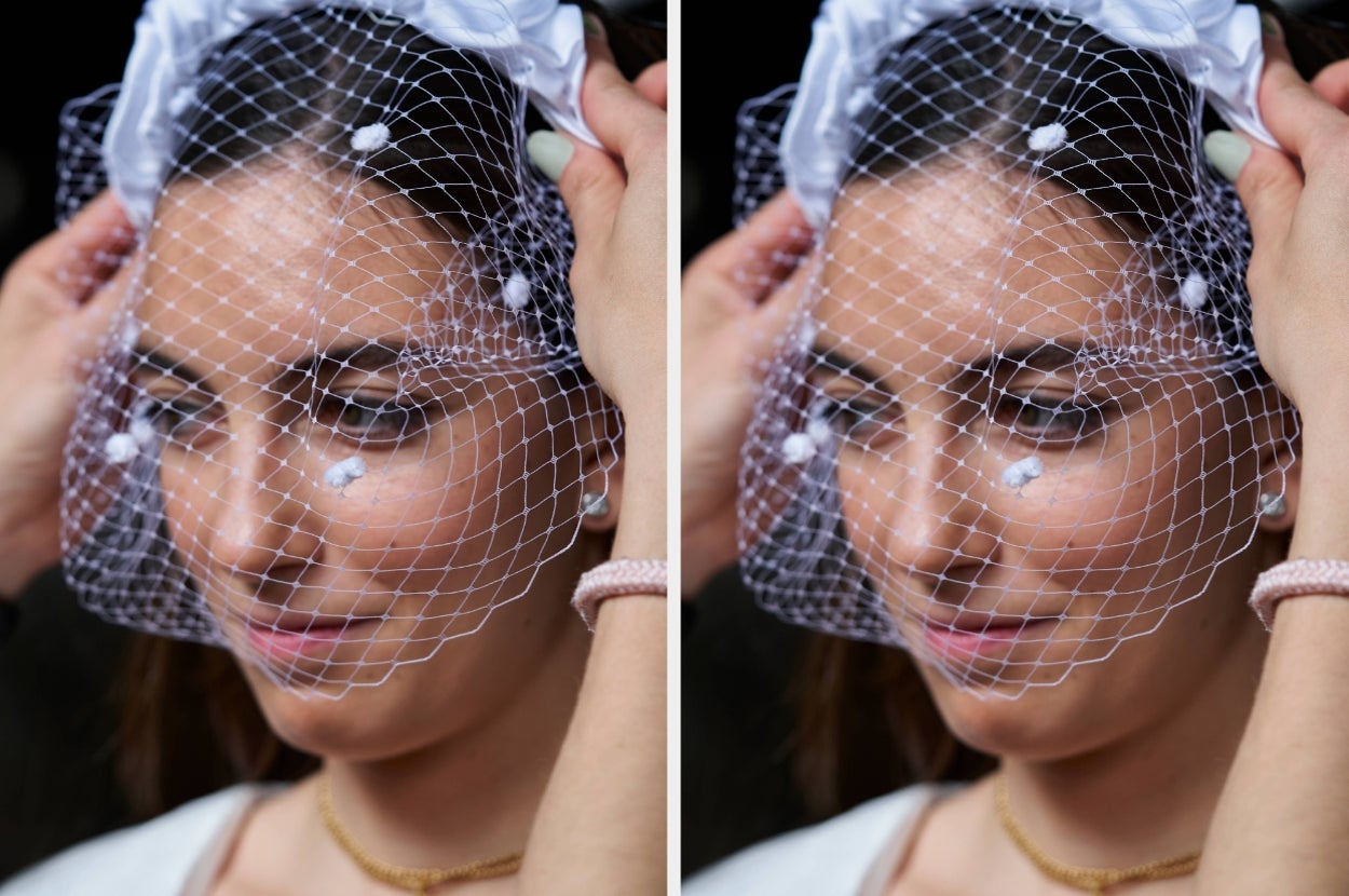 A person adjusts a bridal veil with delicate netting and floral details, showcasing an intimate wedding preparation moment