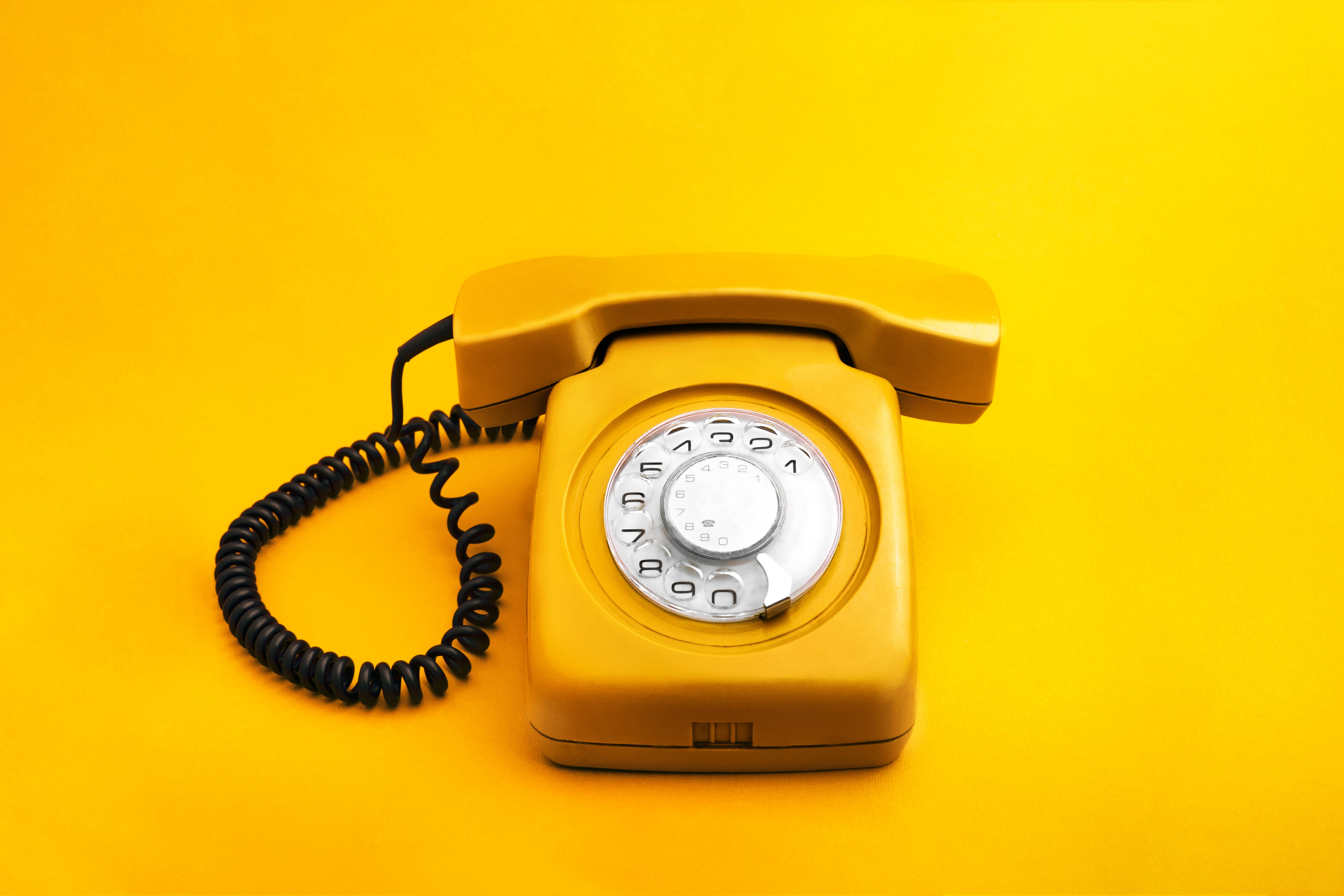 A retro landline connected a coagulated background