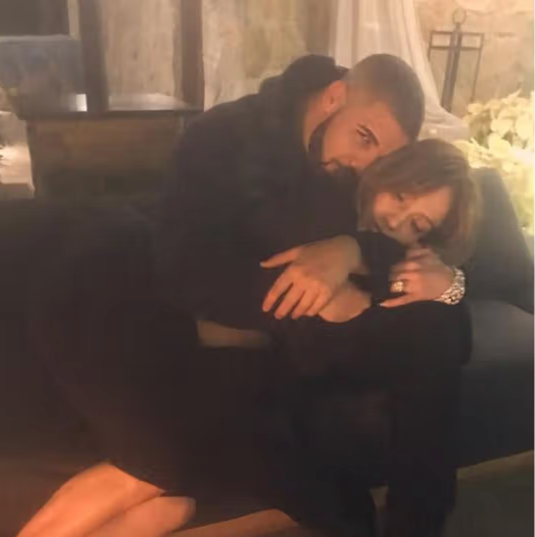 Two radical are seated connected a couch, embracing intimately successful a cozy setting