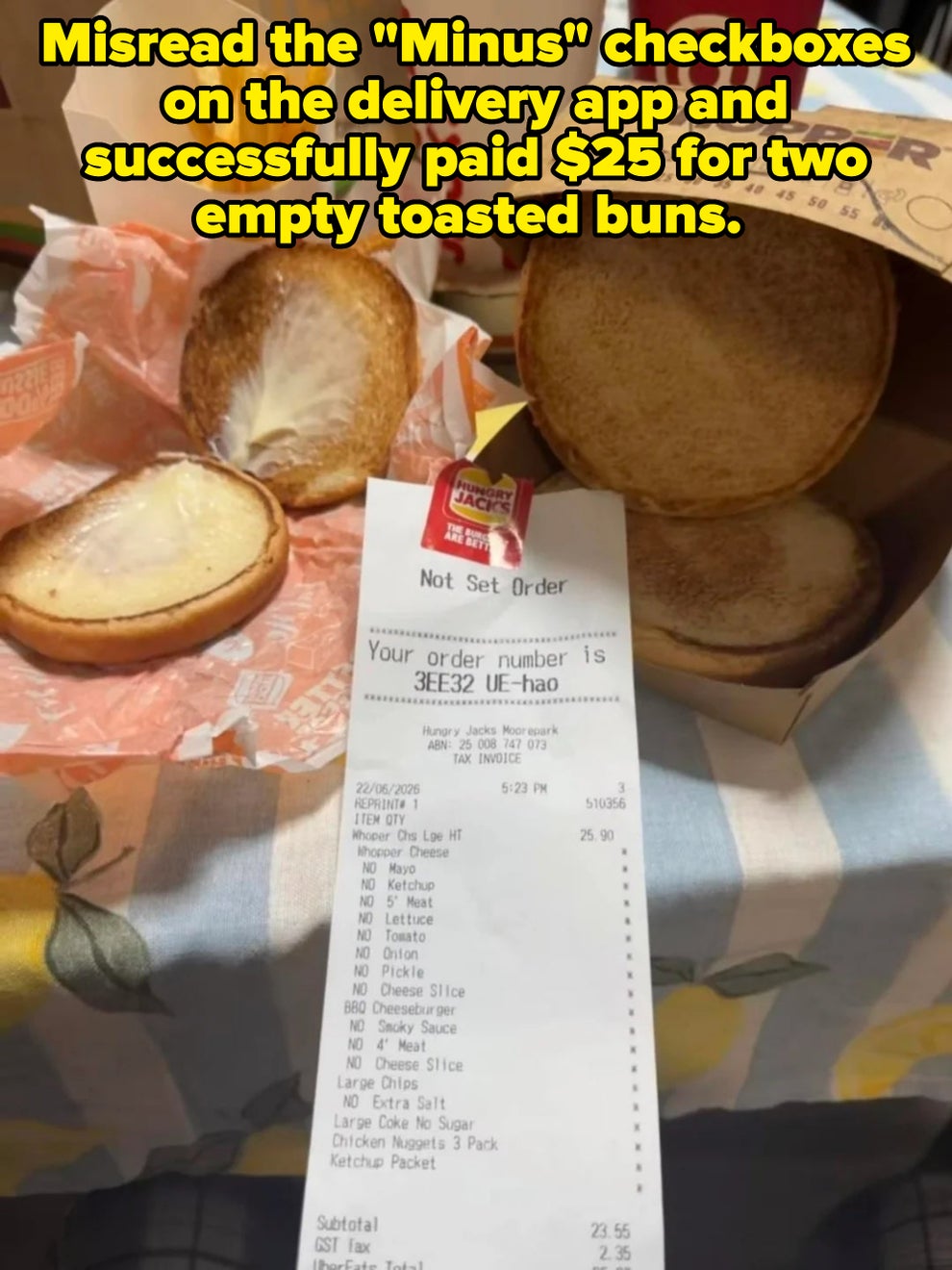 Burger King meal with receipt. The sandwich is missing the patty, showing bread and sauce. Fries and drink are in the background