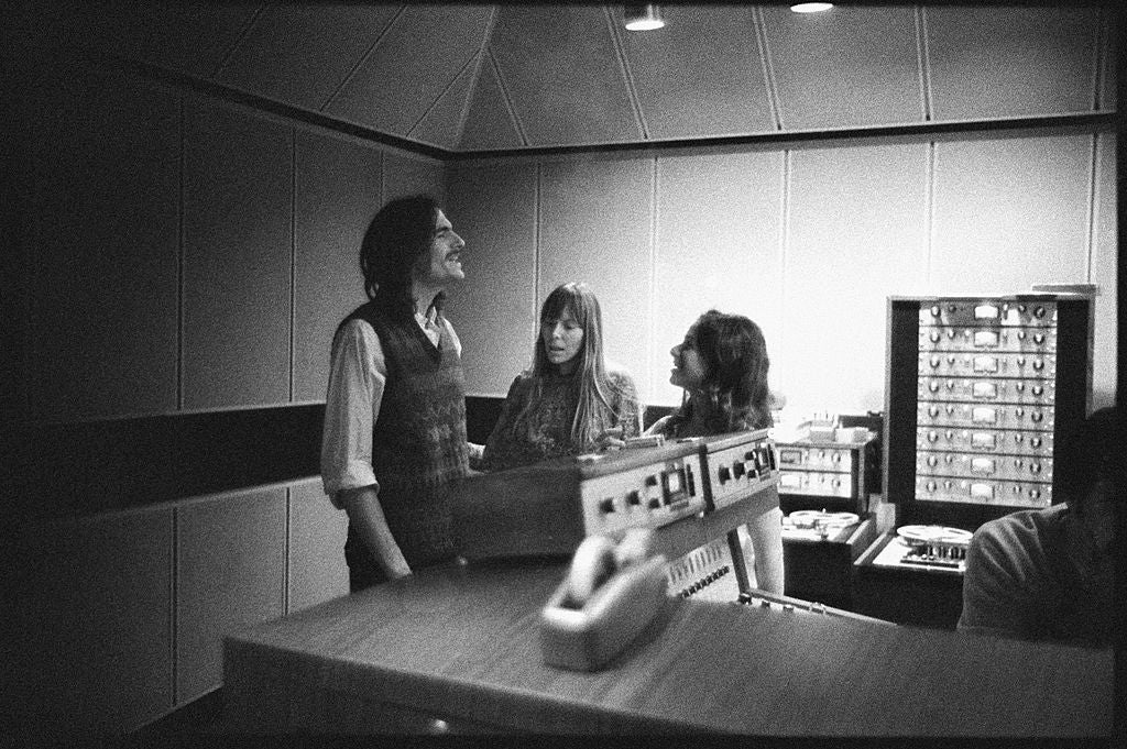 Three radical successful a signaling studio, engaged successful conversation, with signaling instrumentality visible. Vintage style