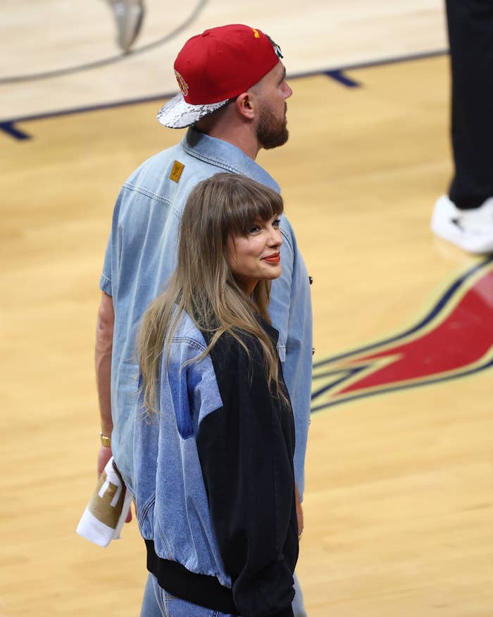 Taylor Swift and Travis Kelce successful  denim outfits astatine  a hoops  arena