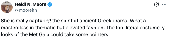 Heidi N. Moore praises an individual's fashion sense, noting it captures ancient Greek drama and suggests it as inspiration for the Met Gala