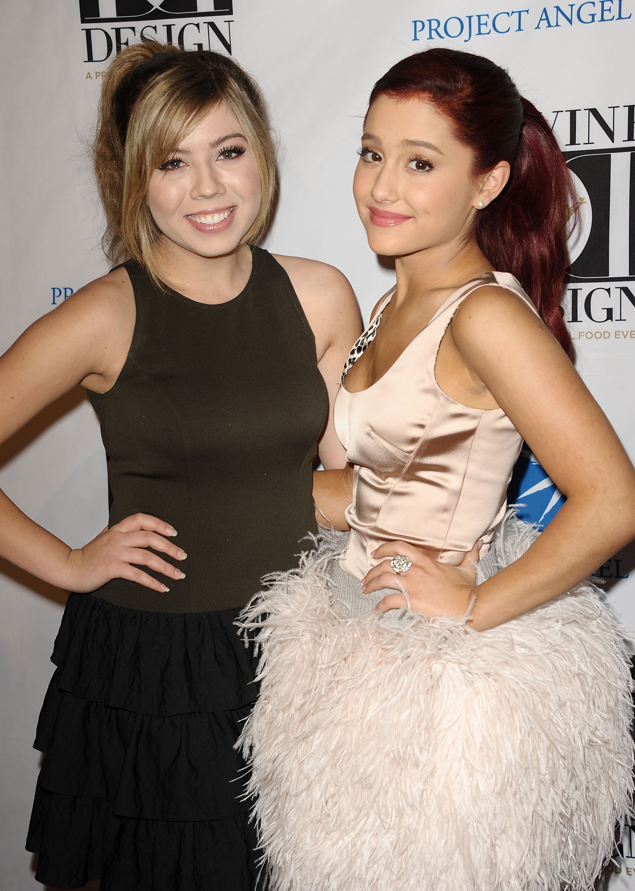 Jennette McCurdy and Ariana Grande pose in a black dress and a white dress at an event