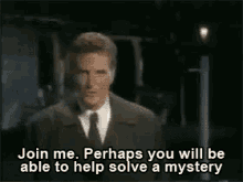 Man in a suit says, "Join me. Perhaps you will be able to help solve a mystery," in a dramatic scene