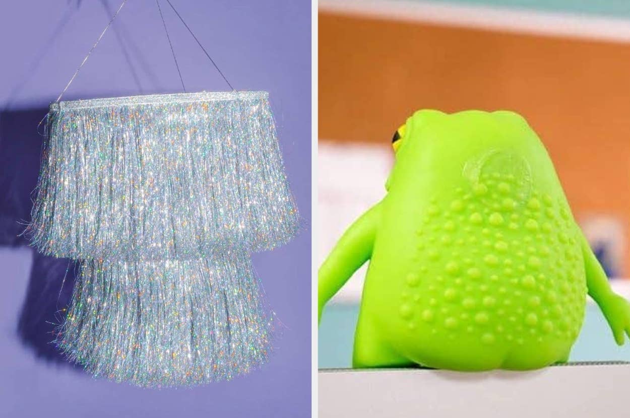 A fringed, shiny lamp on the left and a textured green frog toy from behind on the right