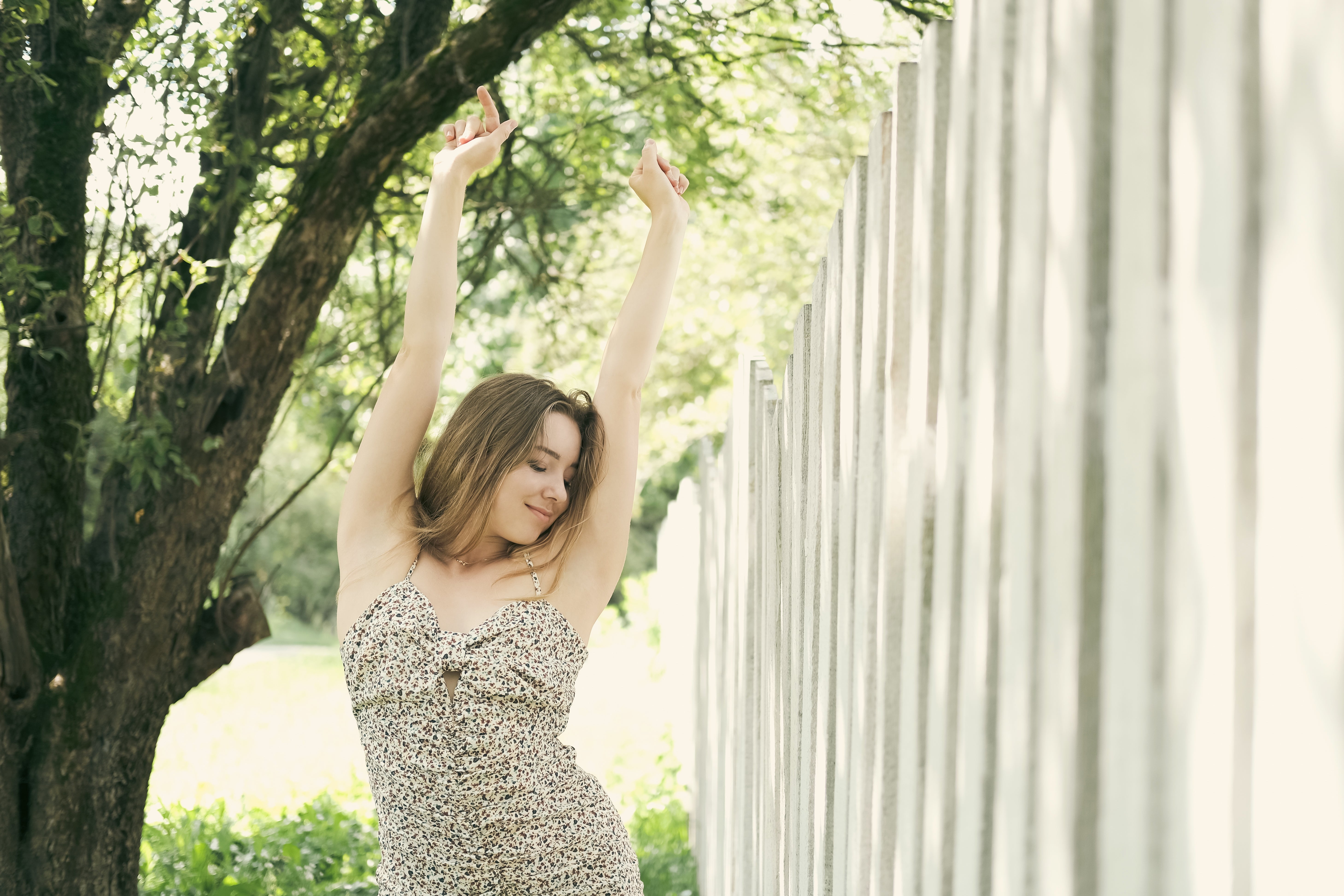 Person stretching portion    leaning against a obstruction   outdoors