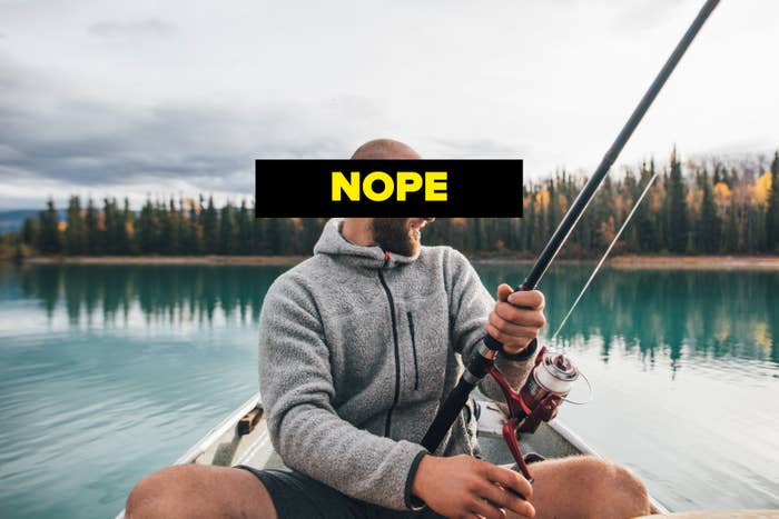 A antheral   sportfishing  connected  a calm lake, sitting successful  a boat, surrounded by wood  and autumn trees